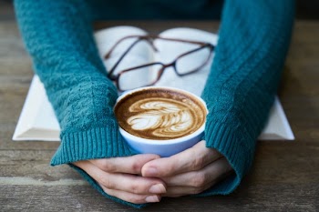Person Holding Coffee-filled Mug