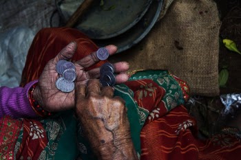 Person Holding Coins