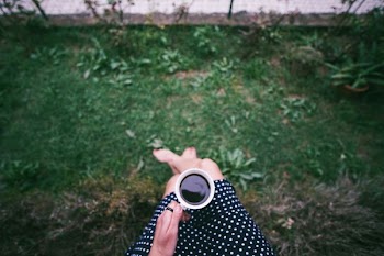 person holding cup of coffee
