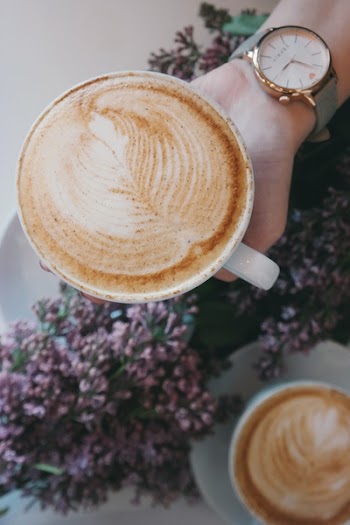 Person Holding Cup of Latte