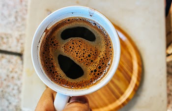 Person Holding Cup With Coffee