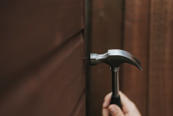 Person Holding Curved Claw Hammer