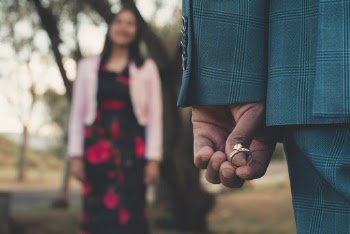 Person Holding Diamond Ring
