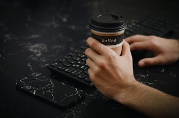 Person Holding Disposable Cup