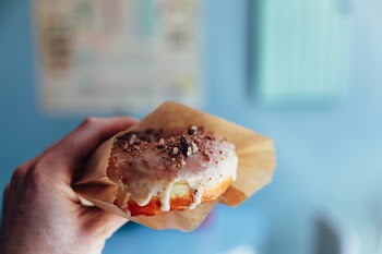 Person Holding Doughnut