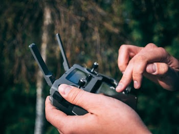 Person Holding Drone Remote Controller