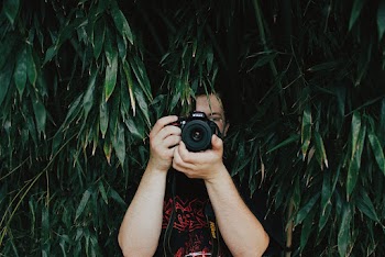Person Holding Dslr Camera
