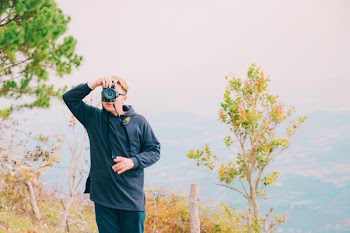 Person Holding Dslr Camera