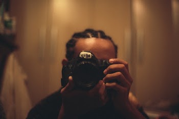 Person Holding Dslr Camera