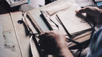person holding envelopes
