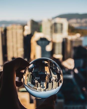 Person Holding Glass Ball