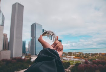 Person Holding Glass Ball