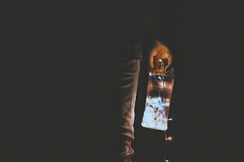 Person Holding Glass Jar