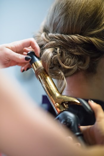 Person Holding Gold Hair Curler