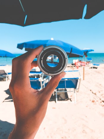 Person Holding Gray Lens