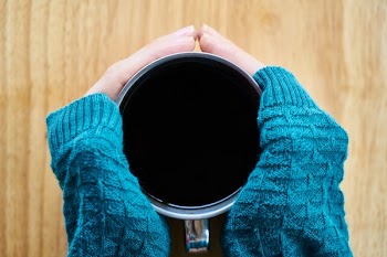 Person Holding Gray Mug