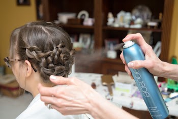 Person Holding Hairspray Can