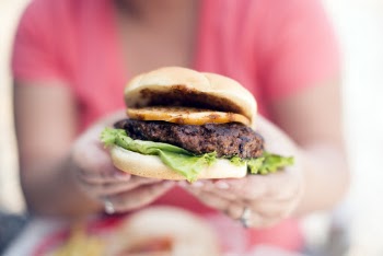 Person Holding Hamburger