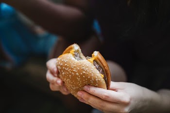 person holding hamburger