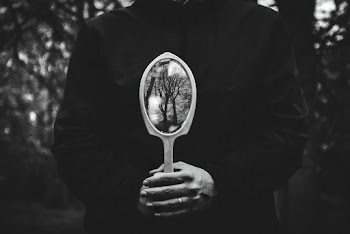 Person Holding Hand Mirror