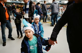 Person Holding Hand With Boy Wearing Blue Hoodie