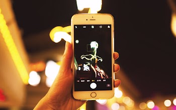 Person Holding Iphone