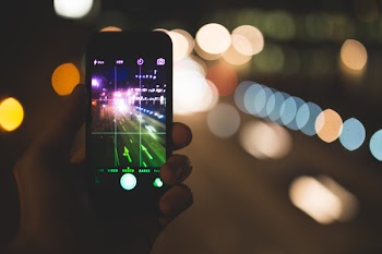 Person Holding Iphone 4