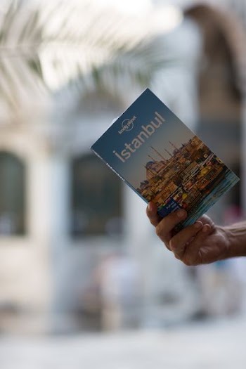 person holding Istanbul book