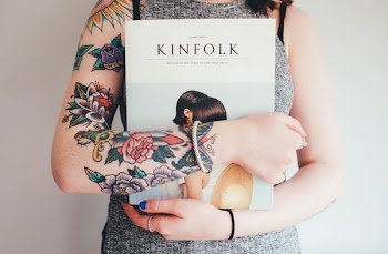 person holding Kinfolk book
