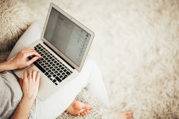 Person Holding Laptop