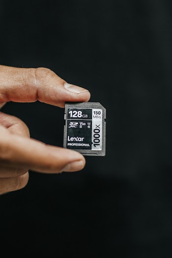 Person Holding Lexar 128gb Sd Card