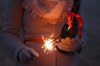 Person Holding Lighted Sparklers