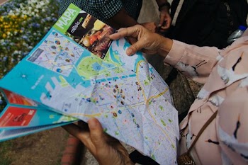 person holding map close-up photo