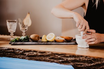 Person Holding Mortar And Pestle