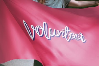 Person holding pink volunteer flag | Free Photo - rawpixel