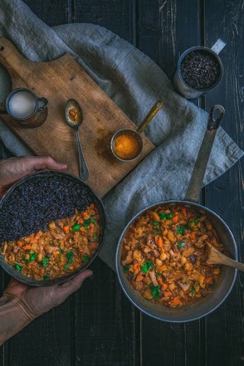 person holding pot with cook food