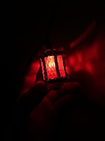 person holding red light