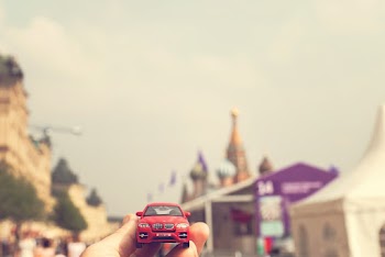 Person Holding Red toy car