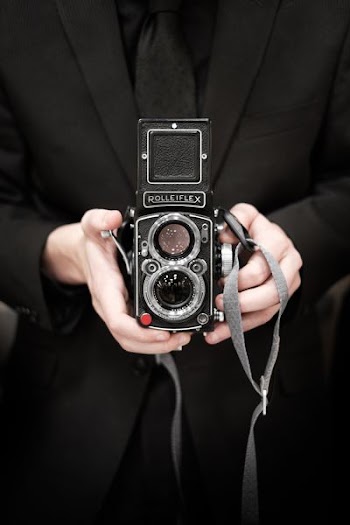 person holding Rolleiflex camera