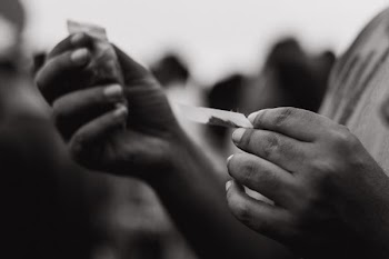 person holding sachet