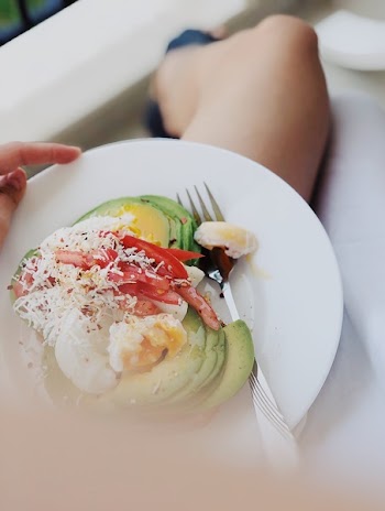 Person Holding Salad on Plate