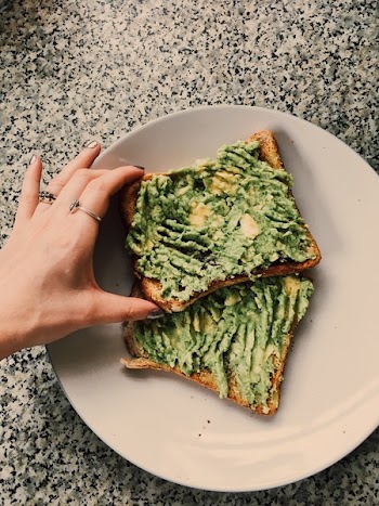 Person Holding Sandwich