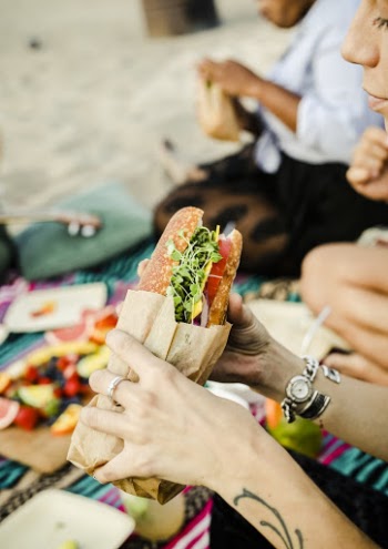 Person Holding Sandwich
