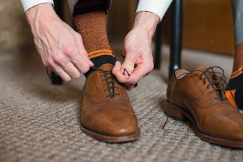 Person Holding Shoe Lace