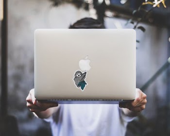 person holding silver MacBook
