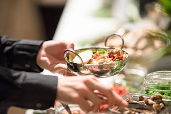 Person Holding Silver Tray Filled With Salad