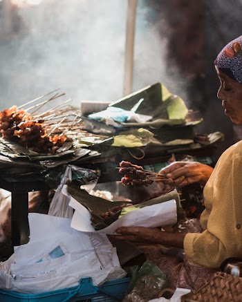 Person Holding Skewers