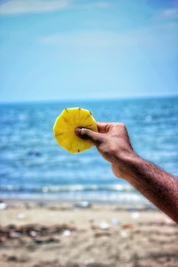 Person Holding Sliced Pineapple 