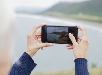 Person Holding Smartphone Taking Photo