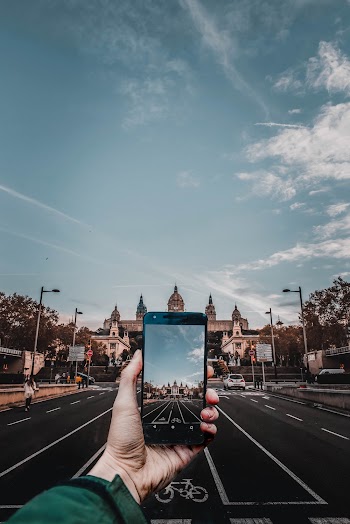Person Holding Smartphone Taking Photo 